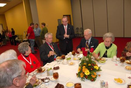 President Dockery fellowships with fellow alum during Homecoming.  President Dockery was presented with the Honorary Alumnus Award during the Alumni Awards ceremony. - Photo by Morris Abernathy