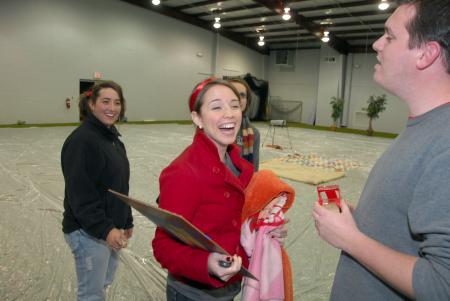 Neal Rager (right), coordinator of student leadership, cracks a joke with Merry Hindman (left) and Jennifer Tharp (center) shortly before the Homecoming drive-in movie in the Fesmire Field House. - Photo by Morris Abernathy
