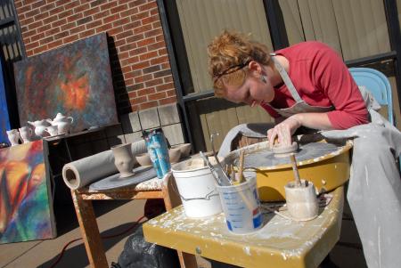 Senior Allison Steele throws a pot at the Arts in the Park event during Homecoming. - Photo by Morris Abernathy