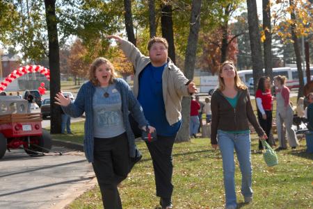 Alum photographers Wendy Reed, Jonathan Blair and Mykle Harchfield enjoy their time together during Homecoming at the Arts in the Park event.  - Photo by Morris Abernathy