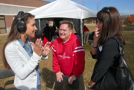 Alum Susan Davie of WNWS does a radio interview with Gary Williams and Alum Laurie Skinkle at the Arts in the Park event during Homecoming. - Photo by Morris Abernathy