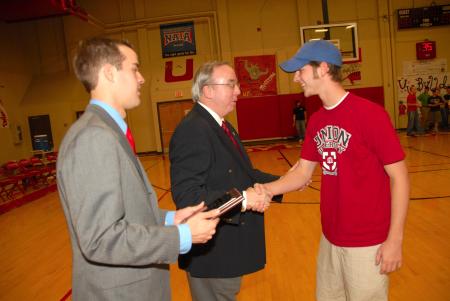 President Dockery and SGA President Landon Preston congratulate Shane Shaddix of the Class of 2010 who finished second in the President's Cup Homecoming competition.
 - Photo by Morris Abernathy