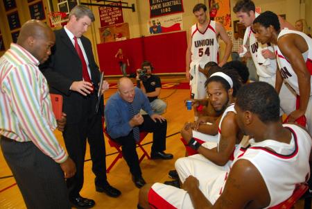 Head Coach Ralph Turner, now in his 13th season with the Bulldogs, addresses the players during a timeout. - Photo by Morris Abernathy