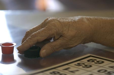Wanna Tarpley plays Bingo during one of Union's Day of Remembrance projects at Elm Croft Assitant Living Home.  - Photo by Heather Phillips
