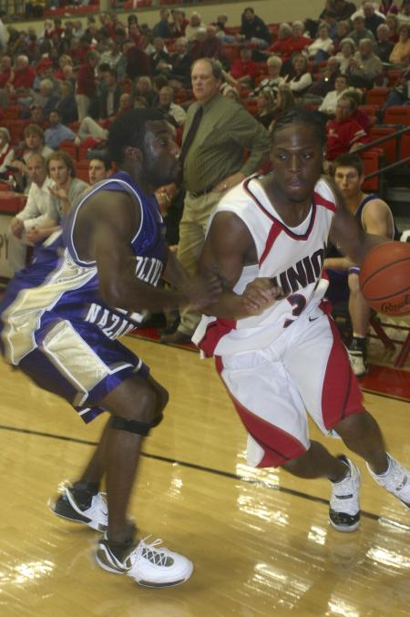 Senior Mack Bealim drives toward the baseline during the Homecoming game against Olivet Nazarene University, Ill. - Photo by Stephanie Schroeder