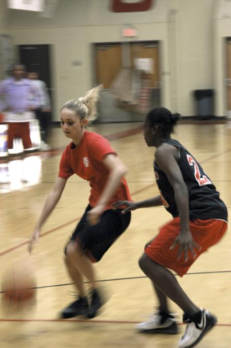 Sophomore Hilary Dublin, learning foundations major, drives against Lady Bulldog LaTorya Fuller in the Joes vs. Pros event during Homecoming. - Photo by Matthew Diggs