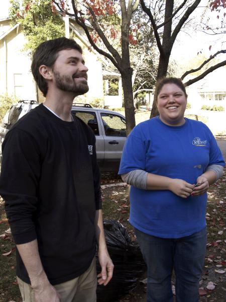 Stephanie Perry and Justin Philips poke fun at their SAC teammates painting skills the Young Life house as a part of Remembrance Day.   - Photo by Beth Spain