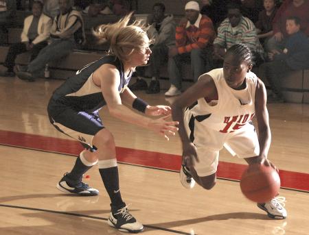 Lady Bulldog LaTorya Fuller drives past a Vanguard University defender during the Rotary Classic tournament. - Photo by Matthew Diggs
