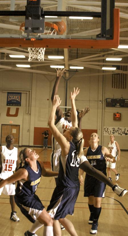 Josephine Owino goes up for a shot during a game against Vangaurd University at the Rotary Classic tournament.  - Photo by Matthew Diggs