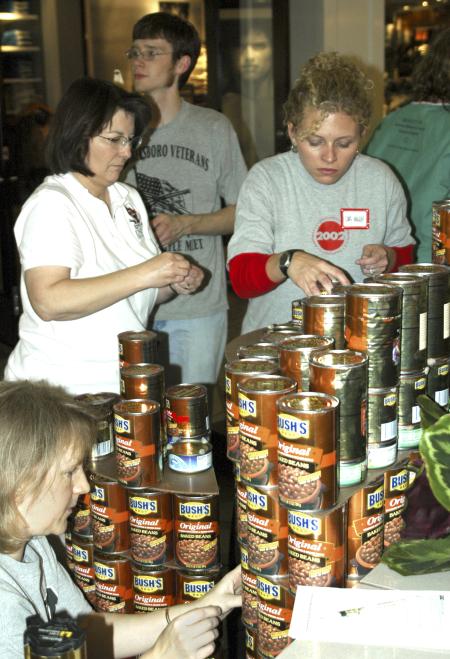 Professors Jeannette Russ, Mary Anne Poe and Lori Nolen come together from different departments to build a sculpture, with help from Ryne Cali, learning foundations major. They were participating in RIFA's Canstruction, held at the Old Hickory Mall. Union's team built a sculpture named &ldquo;Feeding the multitudes&rdquo; which illustrates the story of Jesus feeding the 5000. - Photo by Matthew Diggs
