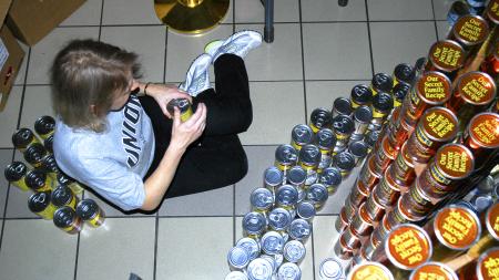Engineering Professor Jeannette Russ, aids Union's team in canstructing the sculpture &ldquo;Feeding the Multitudes,&rdquo; for RIFA's Canstruction event at the Old Hickory Mall in Jackson. - Photo by Matthew Diggs