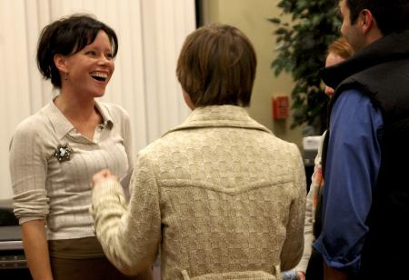 Christian recording artist Sara Groves chats with Alum Jill Zimmer and Senior Drew Zimmer, Christian ethics major, after the 2006 Homecoming Coffee House.  - Photo by Matthew Diggs