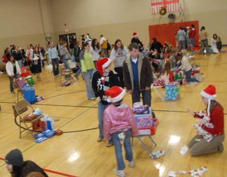 Union groups bought Christmas presents and presented them to children at the SAC Carl Perkins' Christmas Party. - Photo by Morris Abernathy
