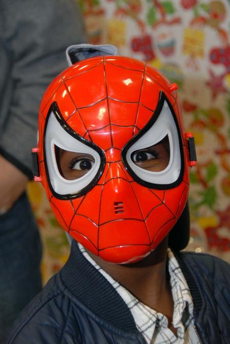 One of the children at the SAC Carl Perkins' Christmas Party shows off his new Spiderman mask. - Photo by Morris Abernathy