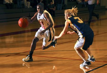 Lady Bulldog LaTorya Fuller drives past the defense of Mid-Continent University, Ky. - Photo by Matthew Diggs