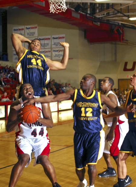 Bulldog Pierry Valmera attempts a shot under the basket against Mid-Continent University (Ky.) - Photo by Matthew Diggs