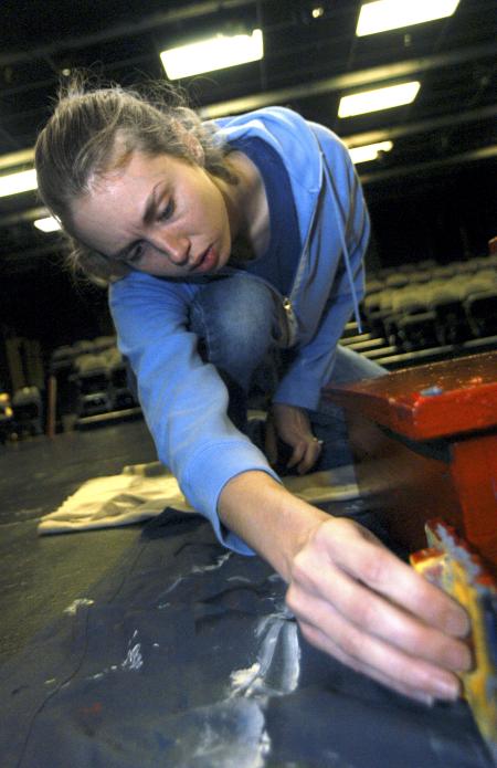 Junior Katie Mathis, theatre/speech major, constructs the set for a one act that she directed.  - Photo by Heather Phillips