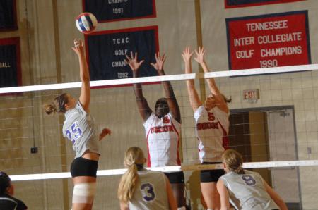 Lady Bulldog seniors Purity Ogalla (6) and Lindsay Holmes (5) block a shot. - Photo by Morris Abernathy