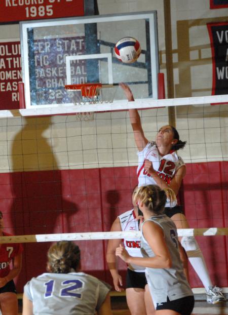 Senior Elena Villagomez returns the ball. - Photo by Morris Abernathy