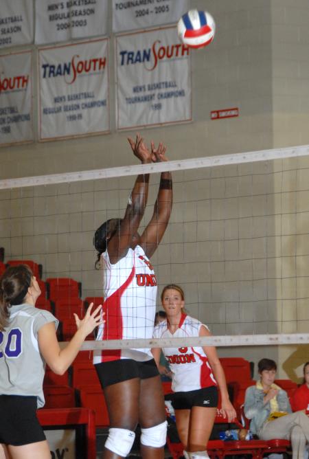 Senior setter Purity Ogalla sets the ball. - Photo by Morris Abernathy