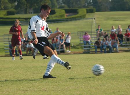 Bobby McColl kicks the ball downfield in a Union win over conference and area rival Freed-Hardeman. - Photo by Steven Aldridge