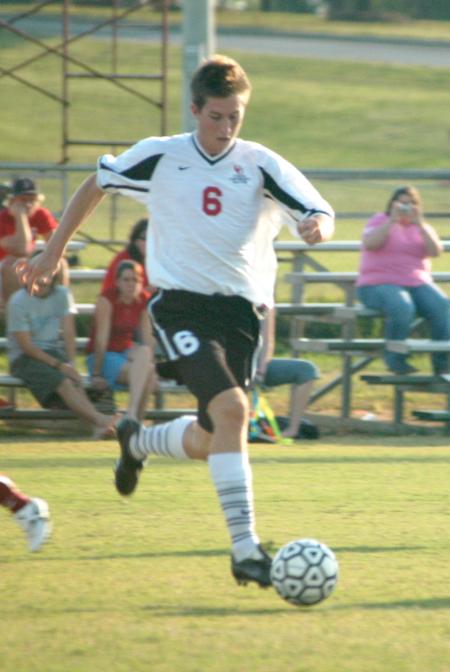 Duncan Nicol (6) works to advance the ball downfield. - Photo by Steven Aldridge