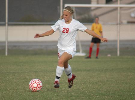 Caitlin Clinger kicks the ball down field to help set up the Union offense. - Photo by Steven Aldridge
