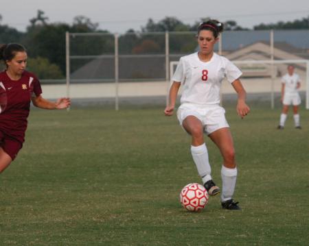 Roxanna Skelton (8) handles the ball as defenders approach. - Photo by Steven Aldridge