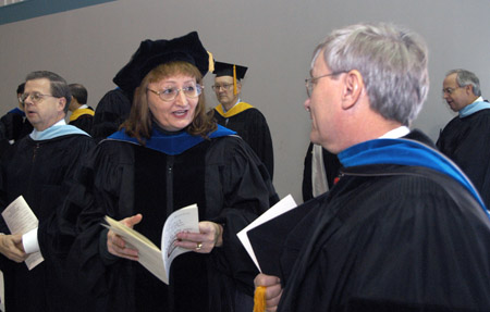 Biology faculty members Carol Weaver and James Huggins prepare for Union's December graduation ceremony. - Photo by Jim Veneman