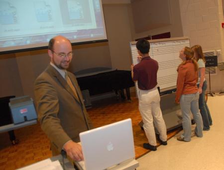 Joshua Veltman, assistant professor of music, runs some listening exercises with his students. - Photo by Morris Abernathy