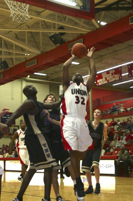 Mack Bealim puts the ball in the hoop in a game against Trevecca Nazarene University, ending in a Bulldog victory. - Photo by Stephanie Schroeder
