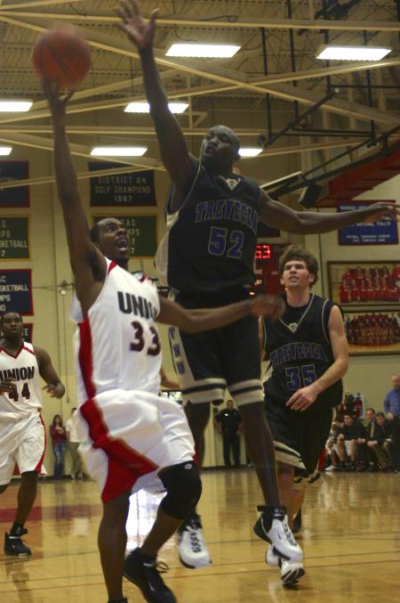 A Trevecca Nazarene University opponent attempts to block a Tony Brown shot. - Photo by Stephanie Schroeder