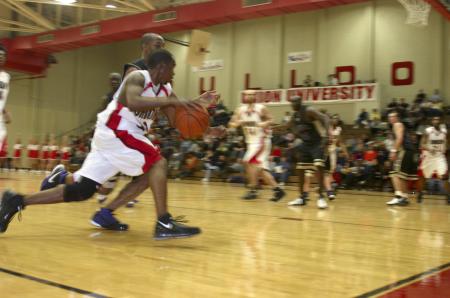 Tony Brown whips around an opponent from Trevecca Nazarene University to complete a lay-up. - Photo by Stephanie Schroeder