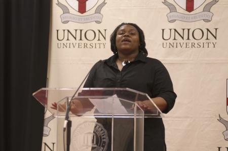 Shawanda Richardson gave a welcome to the attendees of the First Annual Black History Month Program. - Photo by Wayne Holmes