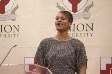 Stephanie Clark, women's basketball assistant coach, sang <em>His Eye Is On The Sparrow</em> during the First Annual Black History Month Program. - Photo by Wayne Holmes