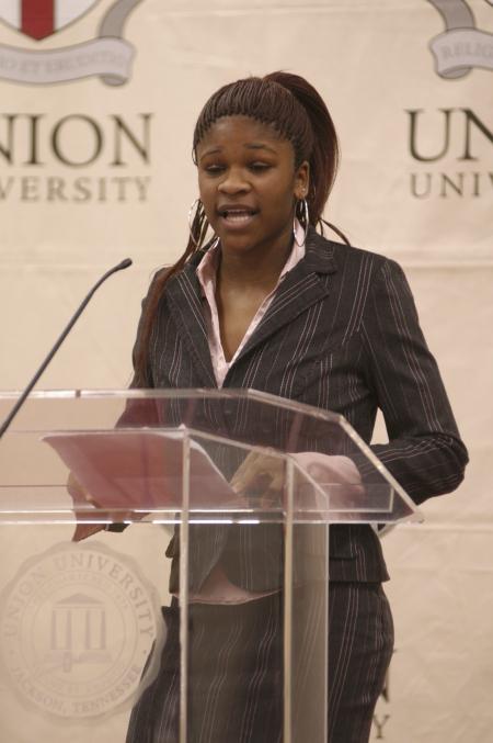 Junior Nikita Taylor presented a biographical sketch of Rosa Parks during the First Annual Black History Month Program. - Photo by Wayne Holmes