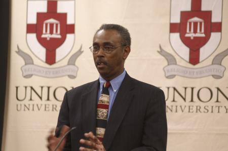 Lonnie Searcy, Union's first African-American student, introduced his wife Camille, the featured speaker, during the First Annual Black History Month Program. - Photo by Wayne Holmes