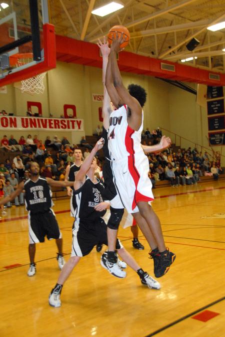 Senior Deywane Lee (24) goes up for a jump shot against Freed-Hardeman in the Union quarterfinal win in the TranSouth Conference Tournament. - Photo by Morris Abernathy