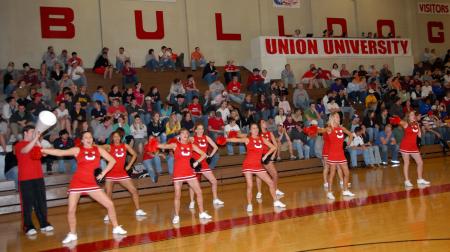 The cheerleading team leads a cheer during the Union quarterfinal win in the TranSouth Conference Tournament. - Photo by Morris Abernathy