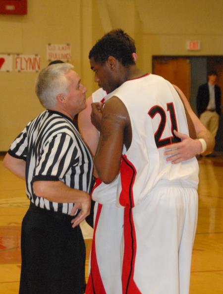 Union's Brian Lake gets instruction from a referee in Union's opening game of the conference tournament. - Photo by Morris Abernathy