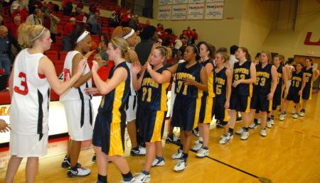 The Blue Mountain Toppers congratulate the Lady Bulldogs after the quarterfinal game of the TranSouth Conference. - Photo by Morris Abernathy