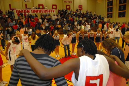Everyone takes time to give thanks after the TranSouth Tournament game. - Photo by Morris Abernathy