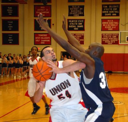 Ben Frederick (54) fights for position against a Lambuth defender during the semi-final game of the TranSouth Tournment. - Photo by Morris Abernathy