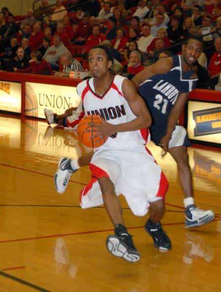 Freshman Tacuma Alexander (3) squeaks past a Lambuth defender during the semi-final game of the TranSouth Tournament. - Photo by Morris Abernathy