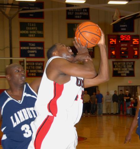 Pierry Valmera (44) struggles to get a shot off despite a Lambuth defender's foul during the semi-final game of the TranSouth Tournament. - Photo by Morris Abernathy