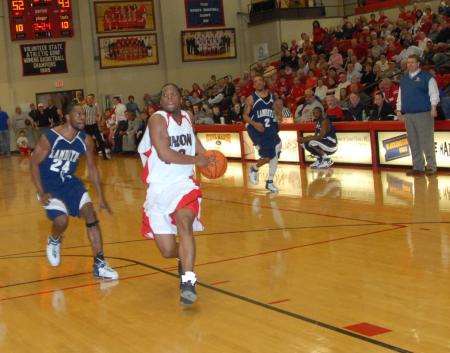 Mack Bealim (32) finishes off a fast break against the Lambuth defense during the semi-final game of the TranSouth Tournament. - Photo by Morris Abernathy