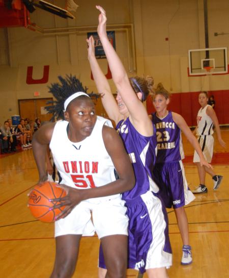 Josephine Owino (51) goes up against a Trevecca Nazarene defender in the championship game of the TranSouth Tournament. - Photo by Morris Abernathy