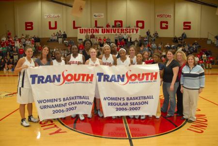 The Lady Bulldogs display their regular season and tournament championship banners after their win in the TranSouth Tournament. - Photo by Morris Abernathy