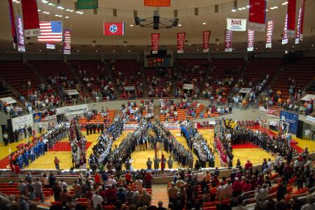 The annual tradition of spelling out NAIA with all the teams of the tournament. - Photo by Morris Abernathy