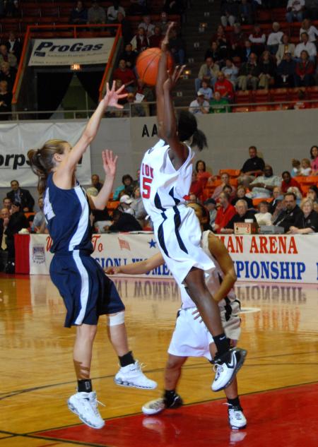 LaTorya Fuller goes up for a block against The Master's College during the first round of the NAIA National Tournament. - Photo by Morris Abernathy